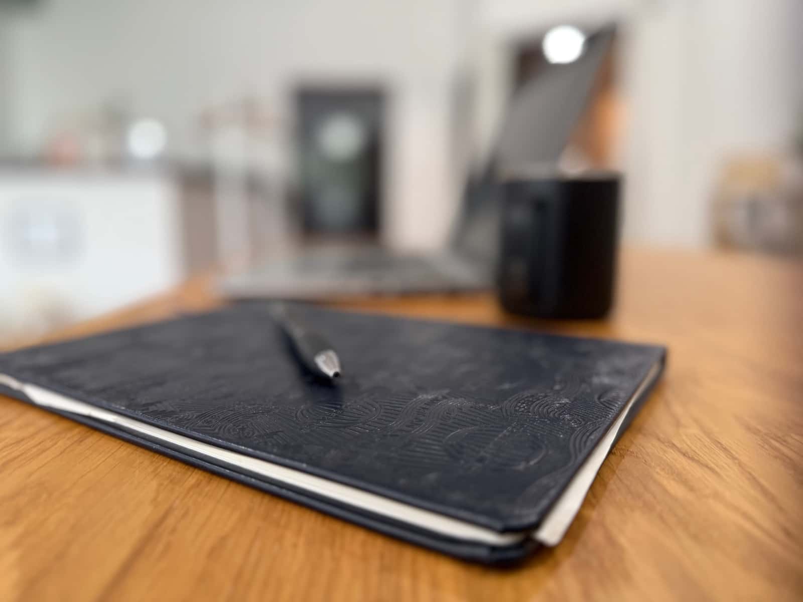 Notebook and desk used for organizing tax and business resources