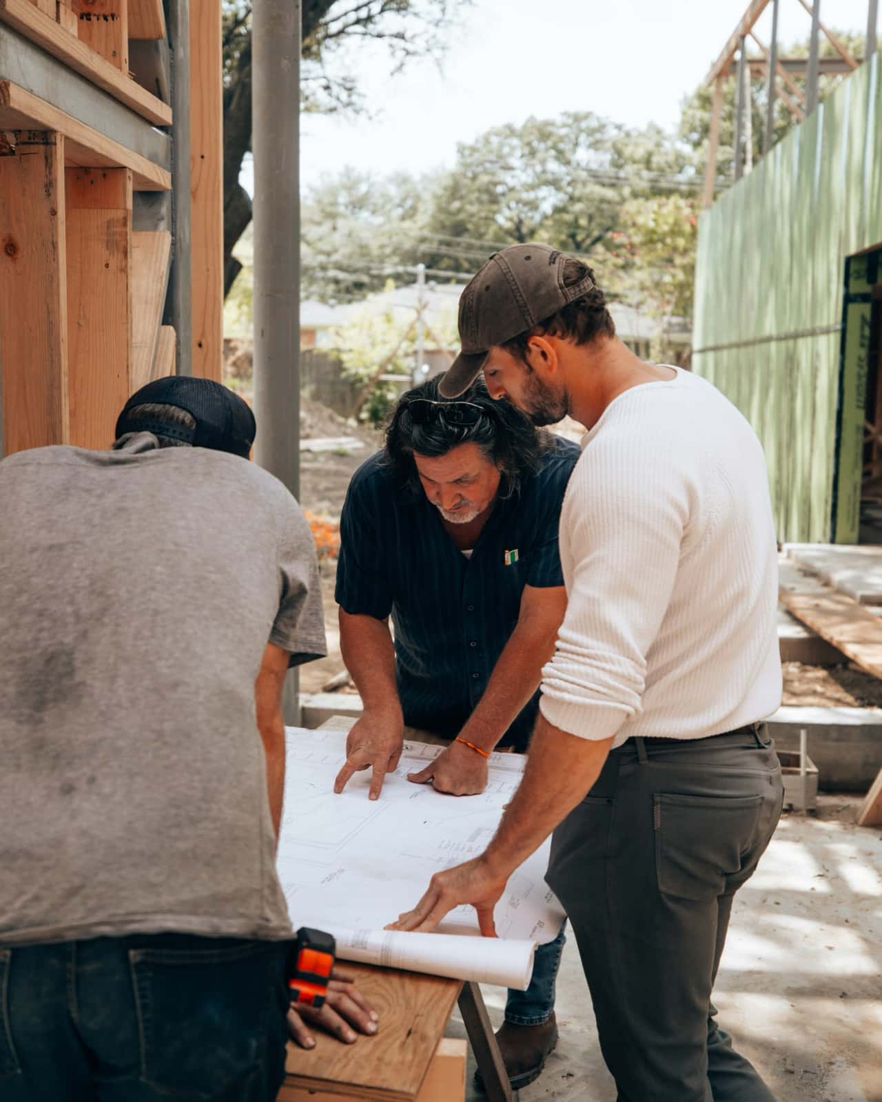 Contractors reviewing blueprints for year-end contractor tax planning