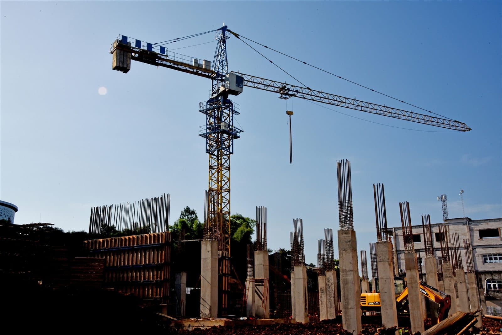 Construction crane at a job site representing a growing business ready for tax advisory planning