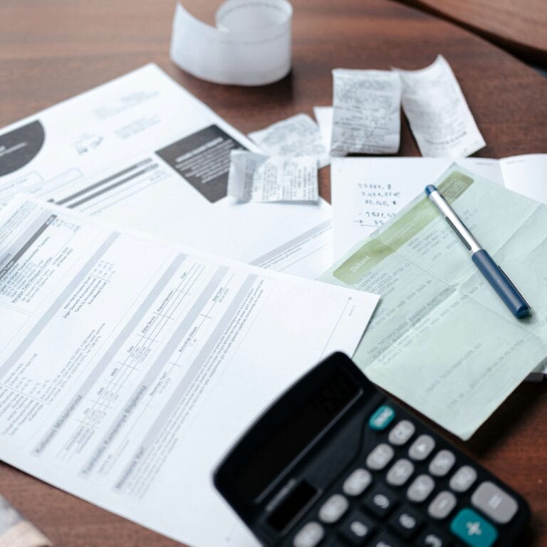 Business owner reviewing tax documents at desk